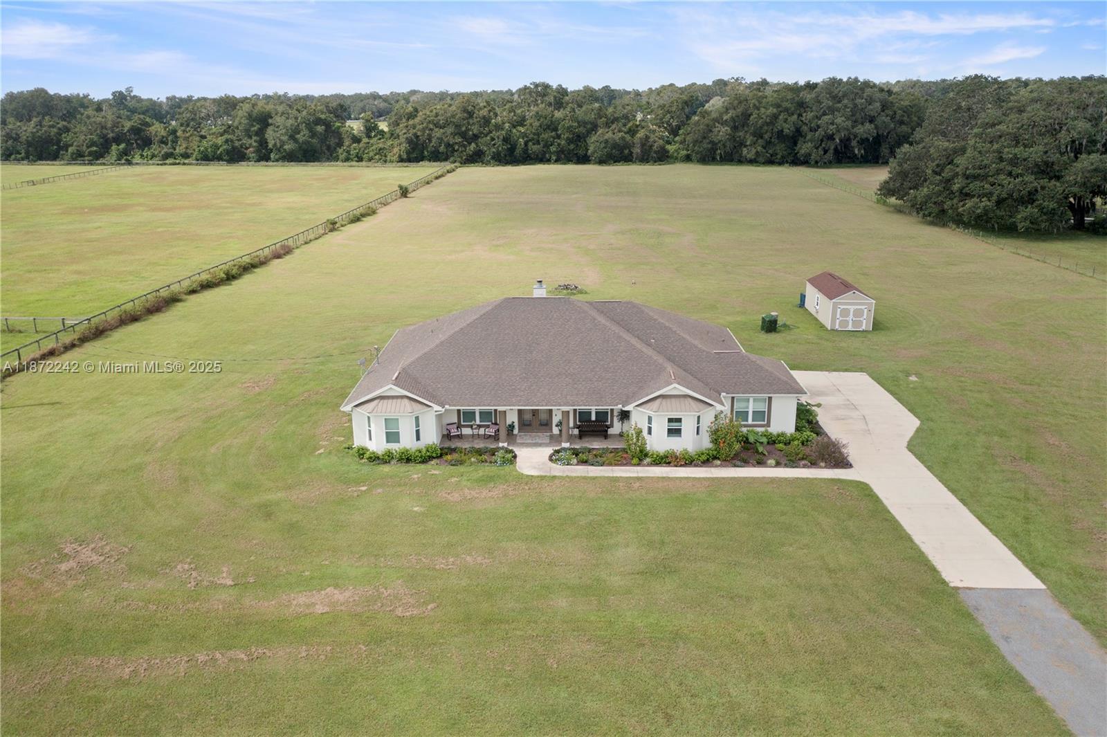 This impeccable high-end design on 10.01 acres awaits your occupancy. Conveniently located close to shopping, dining, and interstate access and only minutes away from The Villages and The Florida Horse Park. This home features an open floor plan with close to 3500 sq ft of living space, 4 over-sized bedrooms with huge closets, 4 stunning bathrooms, large dining room, tons of room to entertain, gorgeous kitchen with huge double islands, functional laundry room and pantry, and so much more. Take advantage of this rare opportunity today! The house is priced competitively and seller is motivated. There were countless additions and upgrades put into the house over the last 3 years, so please do not hesitate to reach out and ask about these upgrades. Schedule a showing today!