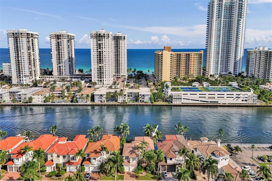 A true gem located on the Intracoastal Waterways on one of the best streets in Harbor Islands!  Boasting 4200 SF, 65 feet on the intracoastal, and a private dock. Spacious, 5 bedrooms, 4 1/2 bathrooms; 4 bedrooms upstairs, and a first-floor bedroom/office with a private bathroom, and a 2-car garage.  This waterfront residence has a private dock, ocean access with no fixed bridges sitting on a spacious lot.  Enjoy this spacious floor plan with soaring ceilings, open, bright and light. A perfect home for entertaining indoors and outside while enjoying the summer kitchen, expansive pool areas, and intracoastal views. The Harbor Islands community offers tennis courts, a resort style pool, exercise room, a private marina, and 24-hour security.  This lovely street offers an additional security gate.