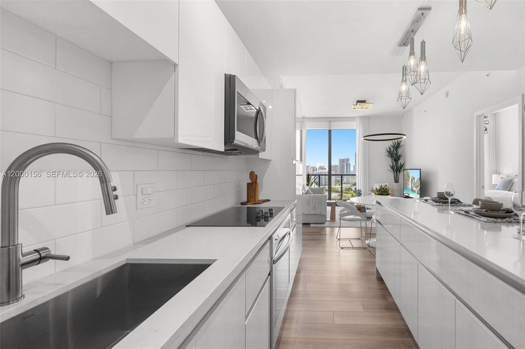 Photo of 101 Diplomat Pkwy #808, Hallandale Beach, FL 33009 (MLS # A12000156)