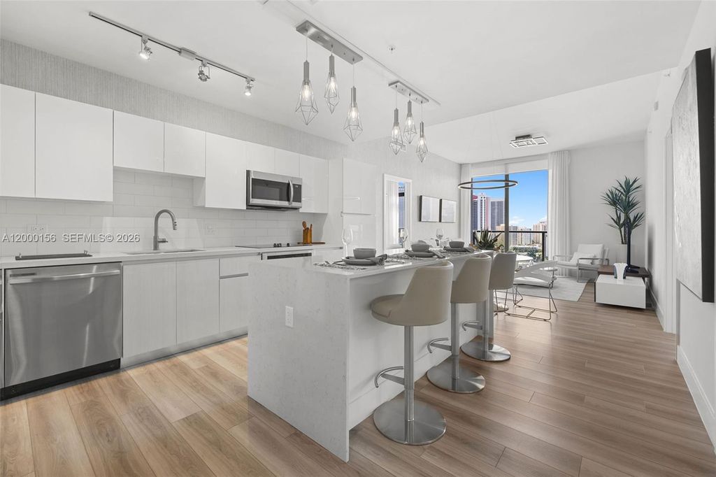 Photo of 101 Diplomat Pkwy #808, Hallandale Beach, FL 33009 (MLS # A12000156)