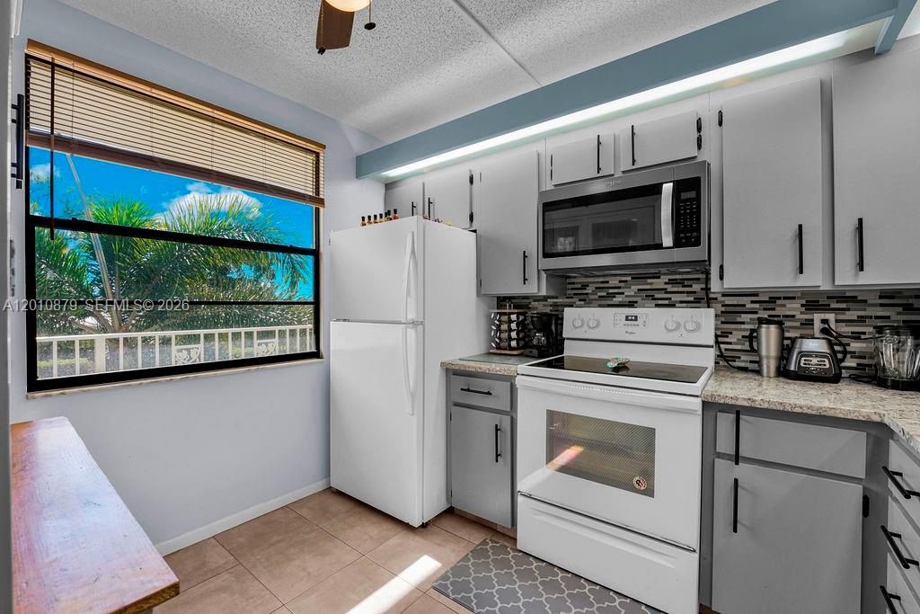 Photo of 6049 Balboa Cir #302, Boca Raton, FL 33433 (MLS # A12010879)