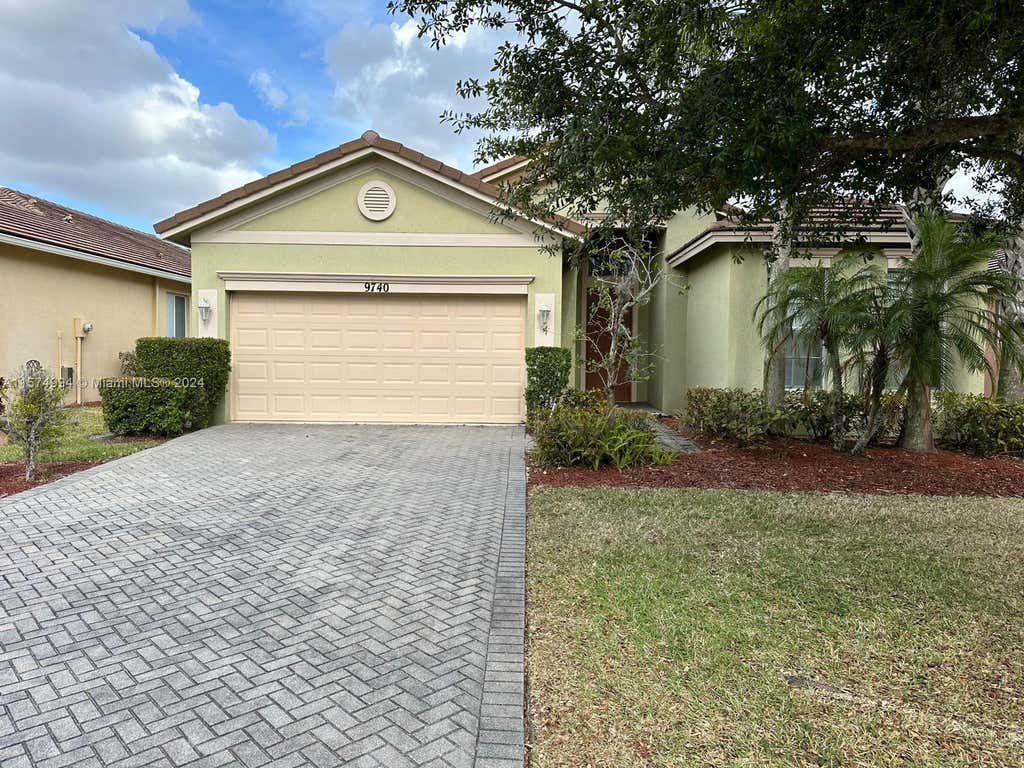 Photo of 9740 SW Lindale Trace Blvd, Port Saint Lucie, FL 34987 (MLS # A11574994)