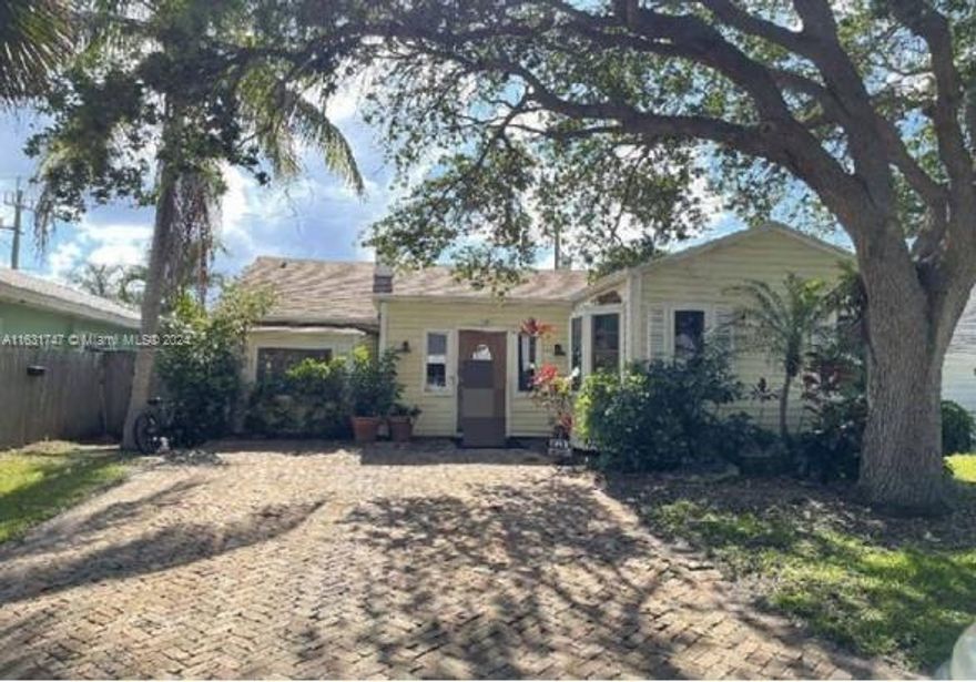 This 1940’s Cottage-Style 4/3 Home is truly one of a kind in the historic Parrot Cove District of Lake Worth.  Located walking distance from the Beach, Intracoastal, Golf Course, and artsy downtown shops and restaurants. As you enter this beautiful home, you are greeted with a gracious wood floor plan that offers a large open living room, 3 spacious bedrooms, and 2 bathrooms. In addition, the house has a possible income producing bonus second story loft with its own living room, bathroom, kitchenette, and private entrance. The main home’s kitchen features J&K Cabinetry, Samsung appliances, and a large dining area. The backyard is fully fenced, with a large covered deck, grill, and beautiful pool. Other features include a new AC, new roof, and separate laundry room with a half-bathroom.