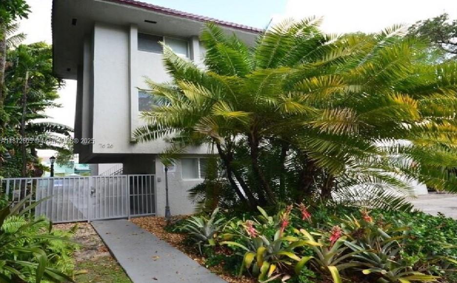 Discover this charming two-story, townhouse-style two-bedroom unit just steps from the beautiful Belle Meade neighborhood. Nestled in a quiet, gated building with off-street (one) assigned parking, this well-maintained unit offers comfort, privacy, and convenience. Enjoy being just minutes from the beach, downtown, and the vibrant Design District. Don't miss this wonderful opportunity to live in one of Miami's most desirable locations!