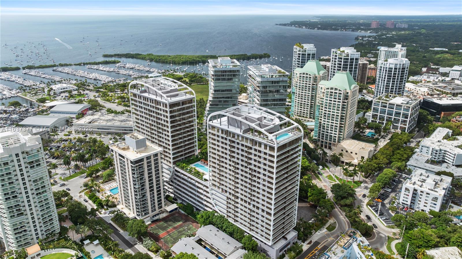 A new level of sophistication & luxury in Miami's Coconut Grove! Unit features panoramic views of bay, city & the Grove. Two-bedroom, two full baths with floor to ceiling windows, 10 ft. ceilings, private outdoor terrace, terrazzo & quartz countertops, custom Italian cabinetry, Wolf & Sub-Zero appliances, porcelain floors & solid wood doors. Unbelievable resort amenities featuring rooftop pool with Bellini bar, spa, fitness center, gourmet market, Concierge reception, butler service, 24-hour valet & security, state of the art fiber optics providing internet & wi-fi access to every corner of the complex & housekeeping services. Exquisitely updated with linen covered custom cabinetry, designer wallpapered rooms, black out shades in bedrooms, sheer curtains, overhead light fixtures & more.