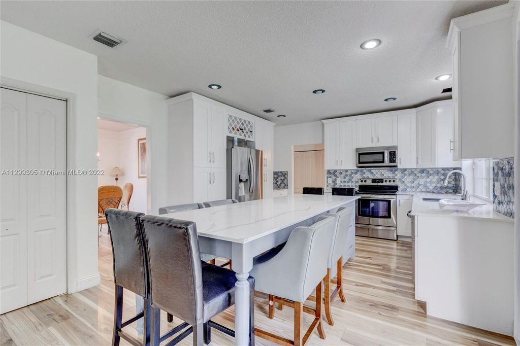 Photo of 3730 Cypress Fern Way, Coral Springs, FL 33065 (MLS # A11299305)