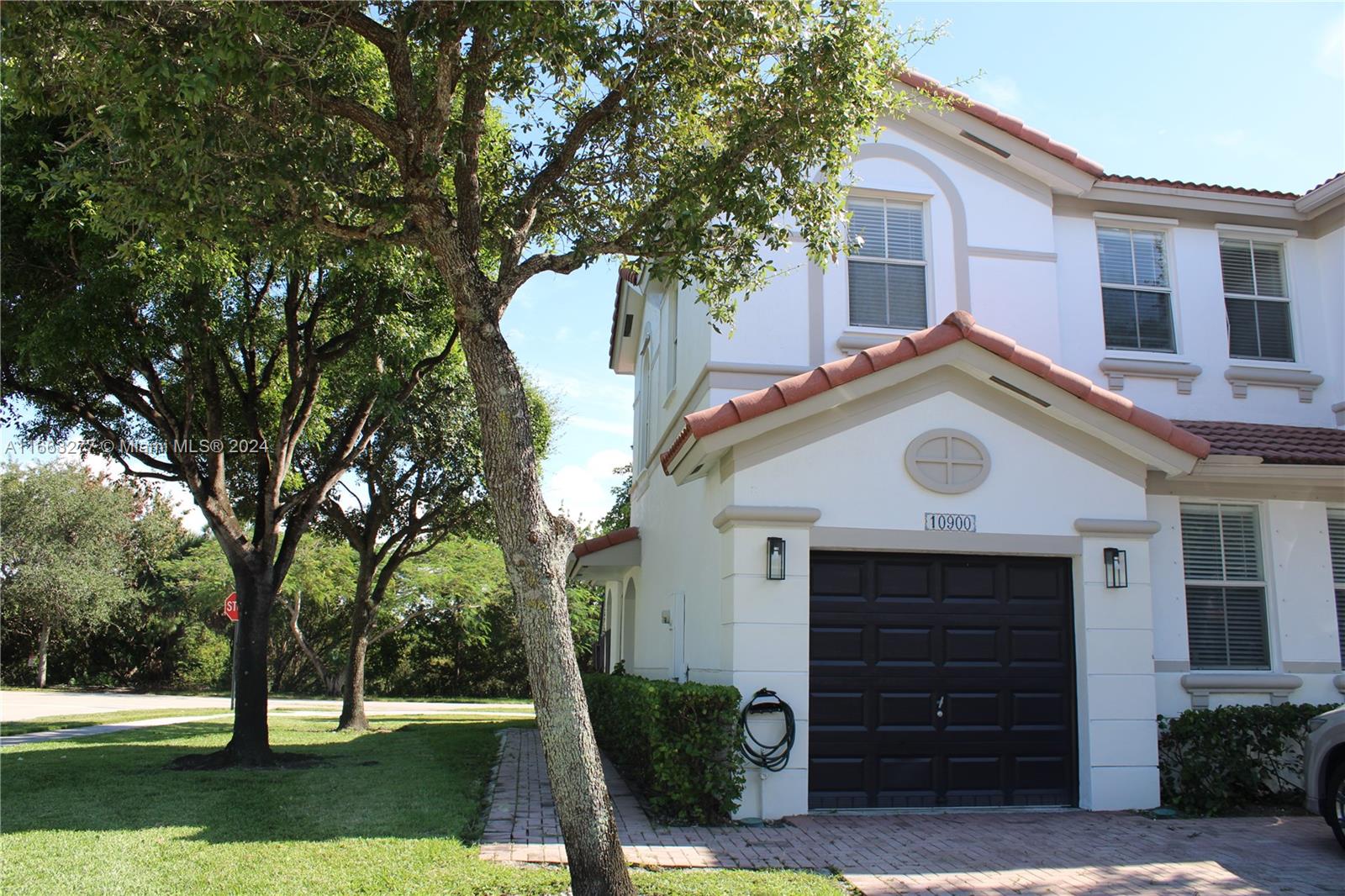 CORNER TOWNHOME 3 Bed / 3 Bath in the highly sought-after community of Antilles at Islands at Doral. This spacious corner unit offers added privacy and is located right across from the community swimming pool. The home features 3 bedrooms, including one conveniently located on the ground floor with an en-suite bathroom, perfect for guests or in-laws. There is a fenced patio, a one-car garage, and additional parking spaces in front of the driveway. Move-in ready, the home is situated in a quiet, family-friendly neighborhood. The community offers a clubhouse with a pool, tennis courts, and a fitness center. This version highlights the ground-floor bedroom with its bathroom and improves the overall readability and flow.