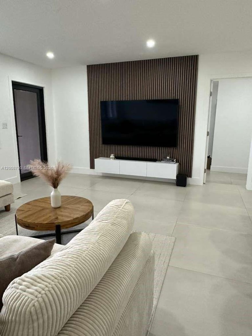 Located in a quiet dead end street  in one of Fort Lauderdale's most desirable neighborhoods, Poinsettia Heights, this spacious 4 bedroom 2 bath home offers the perfect mix of comfort,style and location just minutes from Las Olas Boulevard, holiday park and the beach. As you walk in the home you immediatlely feels warm and inviting, with cozy atmosphere and an open layout. The kitchen stands out right away, featuring a modern design with quartz counter top, plenty of space, and built in appliances. The primary suite is one of the highlights, with a beautifully designed master bathroom and a spacious walk-in closet.this home was updated with quality materials and also includes impact windows and doors,also include recessed lighting,a tankless water heater.step outside to a large backyard with a dedicated area for BBQ and gatherings,plus plenty of space to build a pool and create your own outdoor setup.furniture can be included in the sale.excellent opportunity for homeowners or investors, this property is idea for short-term rental income due to it's prime location near top attractions,dining and entertainment.