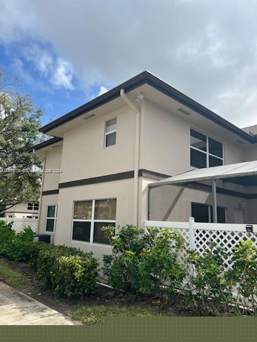 Beautiful waterfront townhouse for sale in the heart of Royal Palm Beach! This stunning 2-bedroom, 2.5-bathroom home will captivate you as soon as you arrive. Enjoy the Florida weather with friends and family on the large, private fenced patio. Fully furnished and turnkey, this townhouse is ready for you to move in. The convenient layout includes a washer and dryer on the first floor along with the living area, and two master bedrooms on the second floor. With serene water views, plenty of windows, and a location far from the street, this home offers tranquility and privacy. Also we have a new roof! The community features a resort-style pool. Don't miss this opportunity!