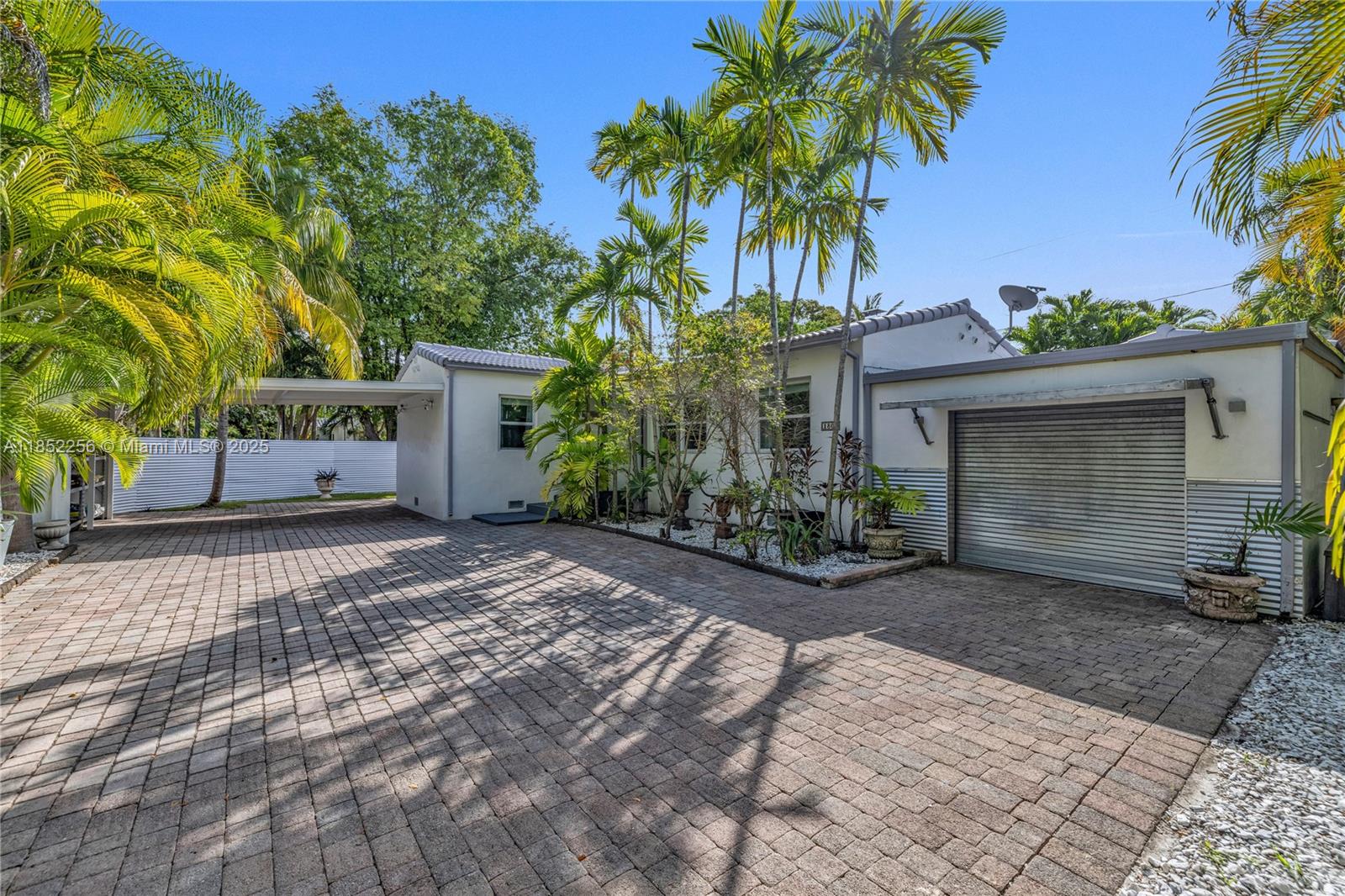 Rare charming Italian-style villa located on a large corner lot in the heart of the Shenandoah neighborhood. Built in 1939 & completely renovated with a total of 3 beds & 3 baths, plus office/den, living room, original fireplace, XL master bedroom closet, formal dining room & a chef-style Kitchen w/ gas stove and stainless steel appliances. Property is fully gated w/ lush tropical landscaping featuring a Fairchild garden. The home has a 2-car carport, garage, shed, & extra large driveway w/ pavers. Perfect for entertaining guests, the backyard has newly installed turf and a large deck complete w/ an outdoor freestanding bar. Incredible location! 10 min walk to Shenandoah park and new aquatic center. 5 min drive to Brickell and Coconut Grove. 10 min drive to downtown Miami & Coral Gables.