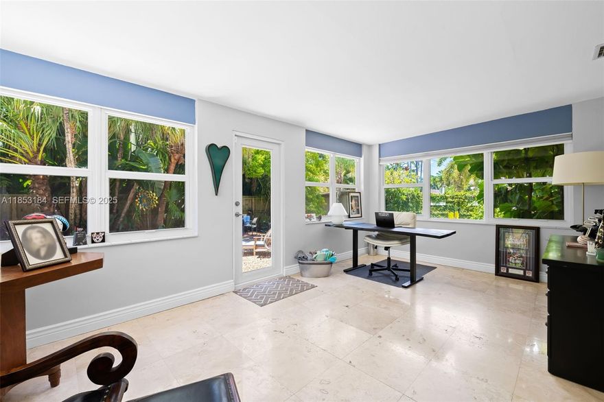 Welcome to serene, beautifully updated, chic Wilton Manors sanctuary. It offers the perfect blend of privacy, style and functionality. Step inside to discover a bright, open layout with abundance of natural lights, travertine marble & terrazzo flooring, high impact windows and doors, tastefully updated bathrooms. Flat tile roof replaced in 2015, A/C 2022, hot water heater 2024, fence 2020, Gourmet kitchen featuring high-end Viking appliances, island and cabinetry galore. This is perfect place for entertainment. The living area extends to a private backyard oasis w/ free shape pool surrounded by tropical lush greenery. It is hard to convey the beauty of the truly enchanting garden especially in nighttime. Great privacy w/11,329sf.ft. One car carport & shed offer extra space for storage.