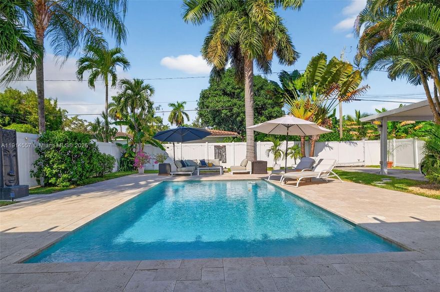 This stylish 3BD/2BA plus Den home brings Hollywood living just minutes from the ocean and Young Circle. Classic Florida charm meets modern comfort with wood floors, renovated baths, full impact windows and doors, and a newer roof. The 2016 saltwater pool creates a true tropical oasis with lush landscaping, citrus trees, a summer kitchen, a covered lounge, and a fully fenced yard. Private alley access leads to a motorized gate carport. City gas powers the range, dryer, and tankless water heater. A perfect blend of vintage charm and coastal living, where every day feels like a beach day. Wonderful parks nearby for easy strolls and kid and dog friendly fun. Very friendly and sought after neighborhood with highly rated schools close by.