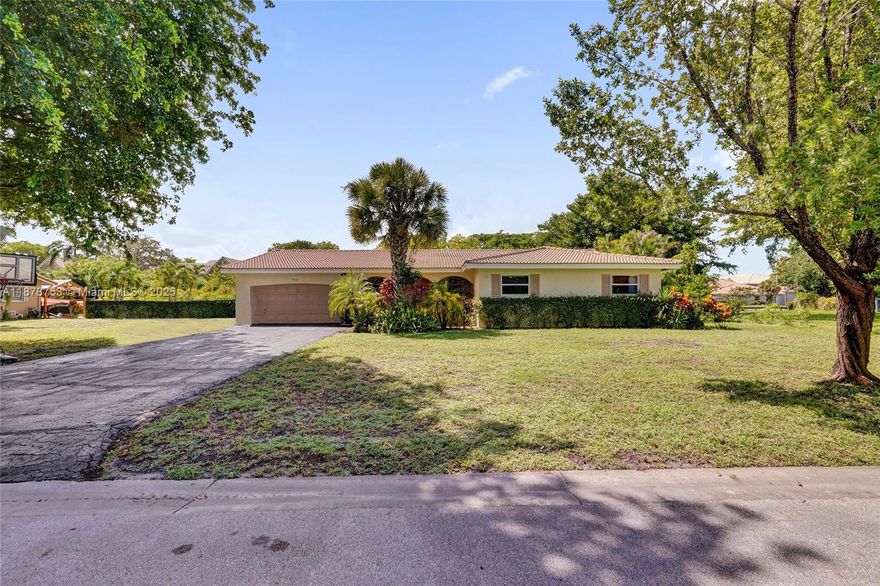 This exceptional 4-bedroom, 2-bathroom homes is the perfect blend of style and comfort The property offers privacy and tranquility while being just minutes away from Coral Springs' best schools, shopping, and parks. Inside, a great use of space is evident, in the large rooms and bedroom plan. The huge backyard is an entertainer's dream, a covered area, an exterior bbq and kitchen and a large, inviting pool. NO HOA, this is the perfect opportunity to create your dream home in a spectacular location nestled on a quiet, family-friendly cul-de-sac