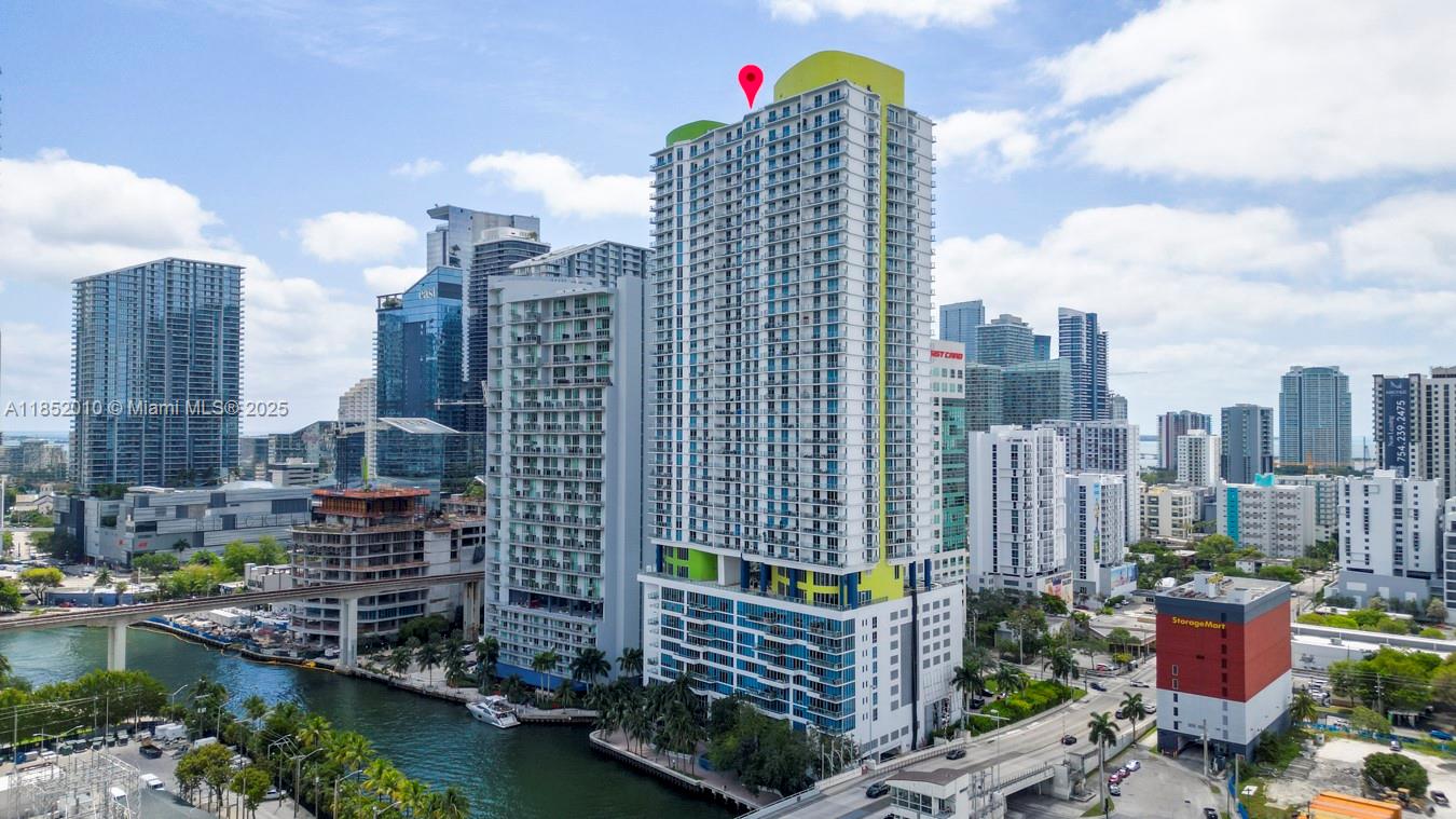 Situated in the vibrant Brickell area, overlooking the historic Miami River, resides a charming condominium within the highly esteemed "Latitude on the River" complex. Embrace the pinnacle of art, shopping, cultural richness, and upscale amenities in this prime location. This presents a unique opportunity to immerse yourself in the complete Miami experience, all conveniently accessible from your own doorstep.