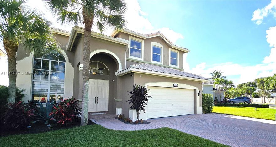 Pinnacle of luxury at Park Lakes, a lakefront residence on exclusive gated Melrose Landing II. This beauty-finished home features 5 bedrooms and 4 bathrooms within 2,916 sqft of elegant living space. The primary suite is sublime, with a spacious walk-in closet, and a large balcony facing the amazing lake where the couple can relax and celebrate the sunset view with glasses of wine. On the first floor is an office with a full bath, 2-car garage, and laundry room washer/dryer & sink. Kitchen has new appliances, a granite countertop, and a kitchen bar. Large family room with TV, and breakfast table. Garage doors open and close automatically. Upgraded 6 outside security cameras can be monitored by smartphone. The outdoor area features a lake and a large garden on the entire side of the house.