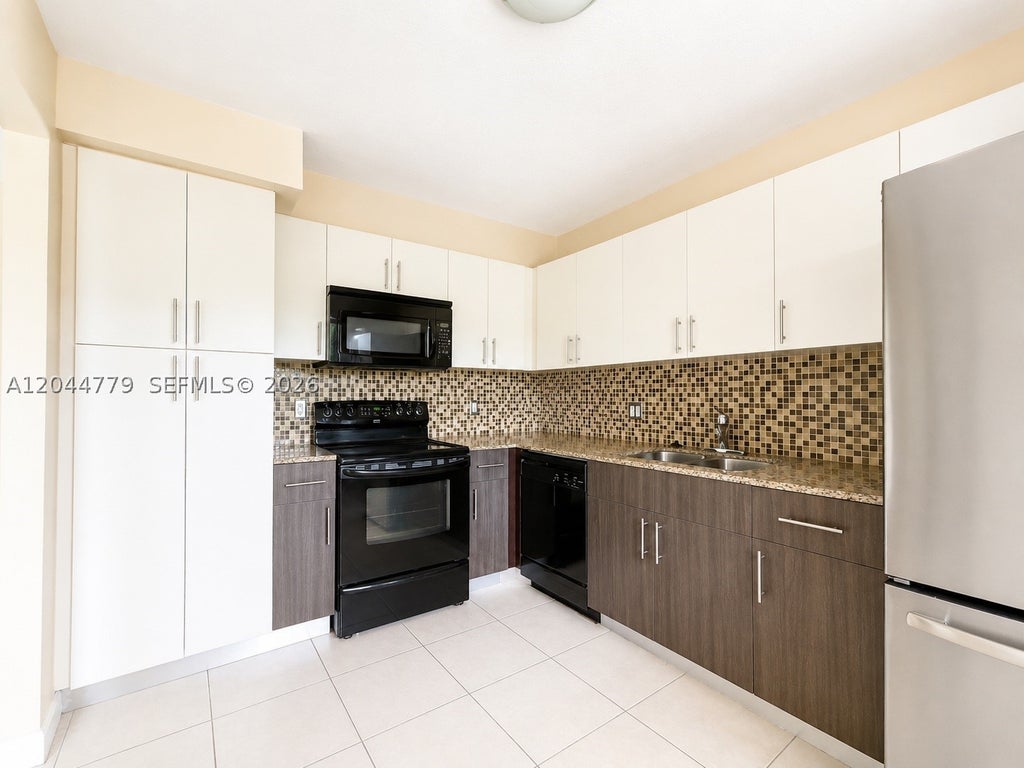 Photo of 405 Lakeview Dr #202, Weston, FL 33326 (MLS # A12044779)