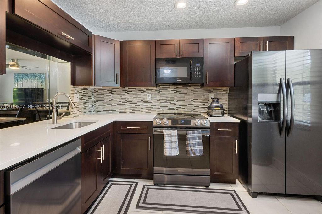 Photo of 3289 S Carambola Cir S #23145, Coconut Creek, FL 33066 (MLS # A12013807)