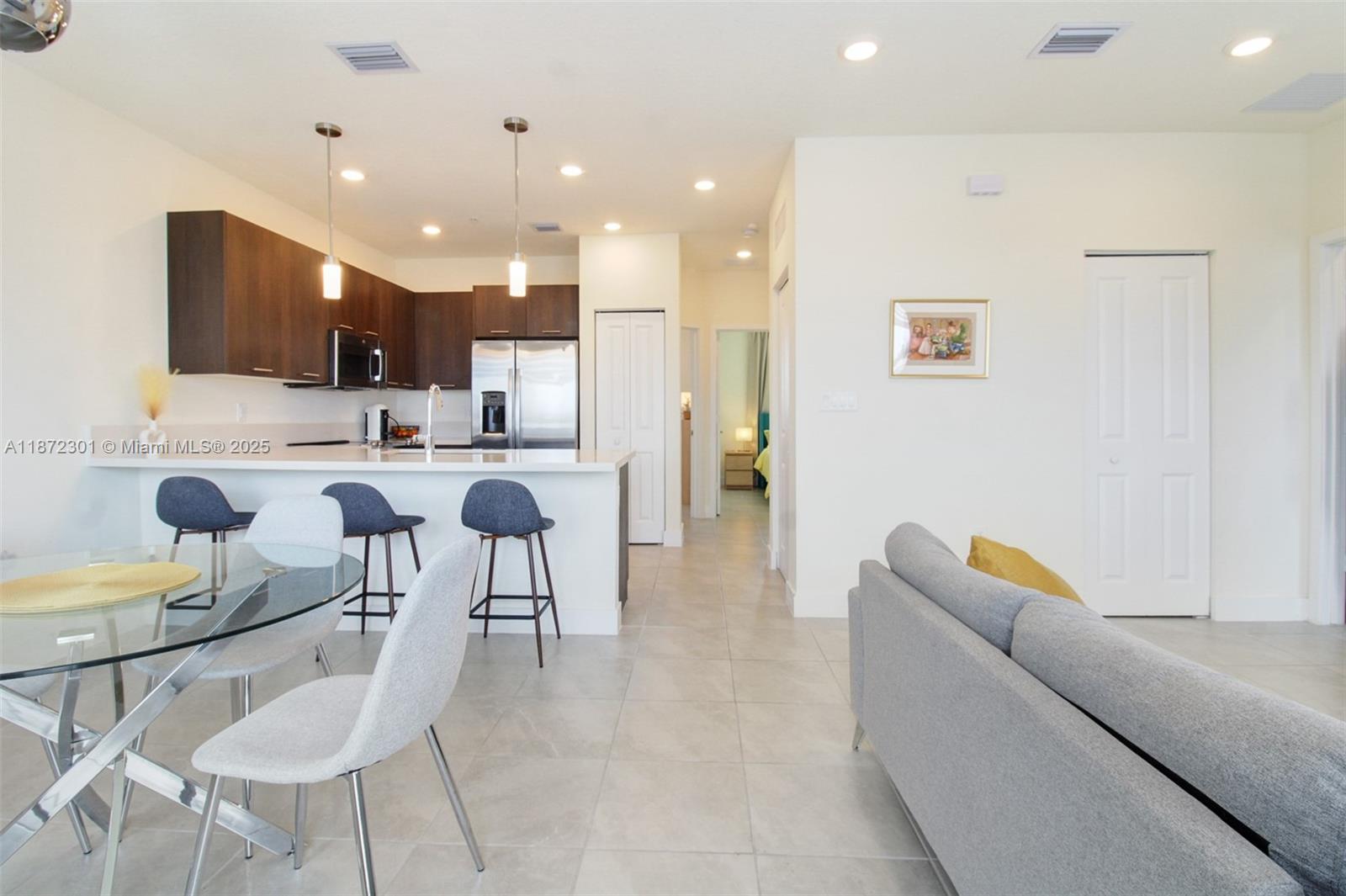 Beautiful 3-bedroom, 2-bathroom condi located in the heart of Doral. This spacious unit offers an open floor plan with abundant natural light, modern finishes, and a functional layout ideal for both living and entertaining. The kitchen features sleek cabinetry, stainless steel appliances, and ample counter space. The primary suite includes a walk-in closet and a private bathroom, while the additional bedrooms are well-sized and versatile. Enjoy the convenience of in-unit laundry, assigned parking, and access to resort-style community amenities including a pool, fitness center, and clubhouse. Perfectly situated near top-rated schools, shopping, dining, and major highways, this property offers the best of comfort and convenience.