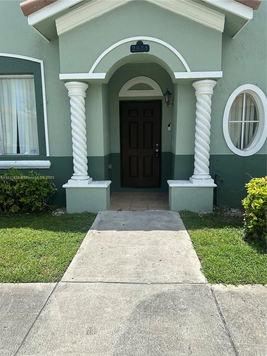 Bright 4/3 townhouse in gated community. This spacious unit offers an open-concept layout. Located in a secure and quiet community of Keys Cove. The first floor features a full bedroom and bathroom, a living room, a kitchen, and a dining area, all of which have tile flooring for easy maintenance. Upstairs, all bedrooms feature laminated flooring, while the bathrooms are finished with tile. This home presents a great opportunity for comfortable living in a conveniently located area. Enjoy peaceful lake views from your backyard, offering the perfect space to relax or unwind after a long day. This move-in-ready home combines comfort and convenience, just minutes from shopping, schools, and major highways. A must-see!