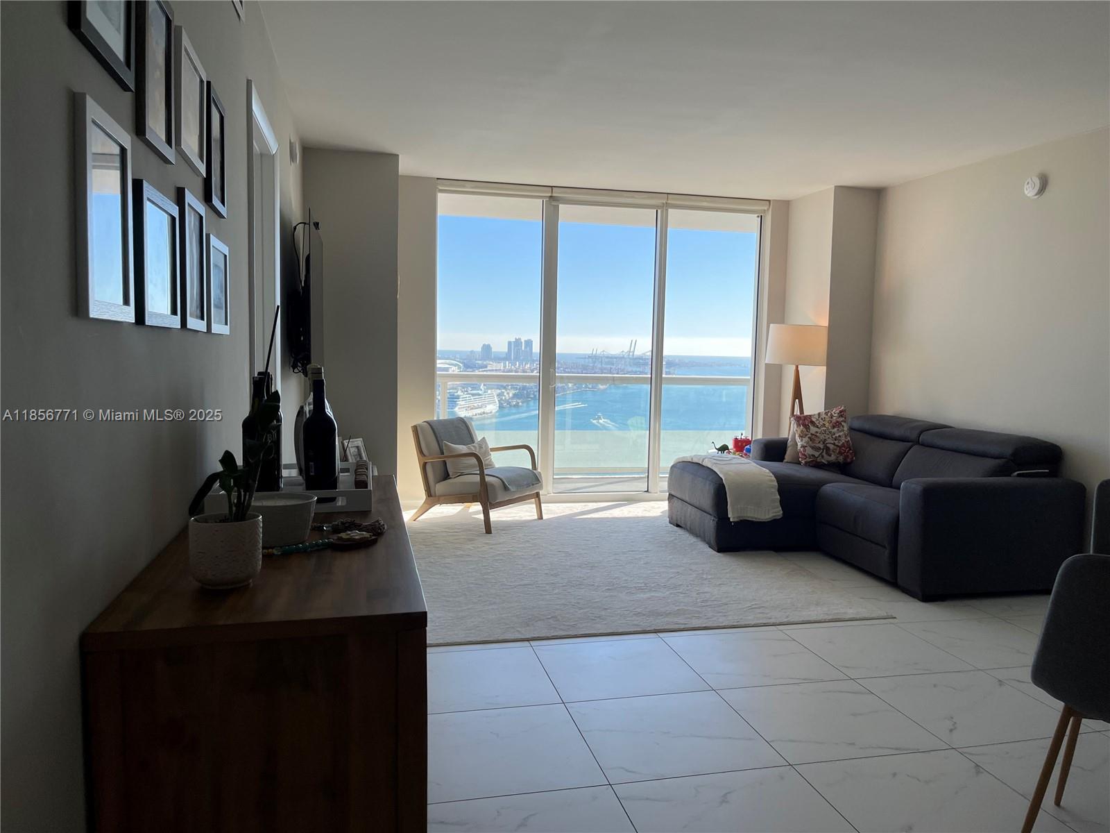 Gorgeous unfurnished 2 + Den. Direct, unobstructed views of the Biscayne Bay from all rooms. A modern kitchen with direct bay and ocean view welcome you into this stunning unit, which features an en-suite master bedroom and a large second bedroom that shares a bathroom with the apartment's den. Large and plentiful walk-in closets ensure plenty of storage space. A large balcony with wonderful views of Biscayne Bay, Port of Miami, and South Beach skyline make this unit a dream to live and work in. Building features lap pool, cabanas, fitness center, and sauna/steam room. The building is well located and a quick walk to Whole Foods, Starbucks, CVS, local cafes/restaurants, and the Metro Mover is a block away. Close to Brickell with easier I-95 access.
