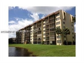 Photo of 3150 W Rolling Hills Cir #403, Davie, FL 33328 (MLS # A12080190)