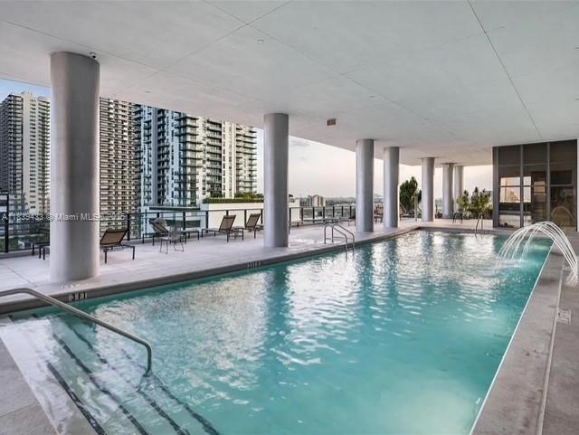 Fully furnished penthouse with 1 bathroom located in the newest luxury building in the Arts & Entertainment District. This high-floor unit offers direct bay and city views through floor-to-ceiling windows and features modern furnishings, an open layout, and premium finishes. The building offers over 30,000 sq. ft. of amenities, including sunrise and sunset pools, Jacuzzi, eco-friendly gardens, sun deck, a 3,000 sq. ft. state-of-the-art gym, spa, sauna, treatment room, indoor/outdoor yoga garden, racquetball court, theater, social room, children's playroom and lab, and an indoor/outdoor pool bar and café. Residents benefit from 24/7 security, concierge service, on-site management, and self-parking. Easy to show!