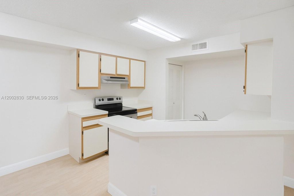 Photo of 9999 Summerbreeze Dr #216, Sunrise, FL 33322 (MLS # A12002830)