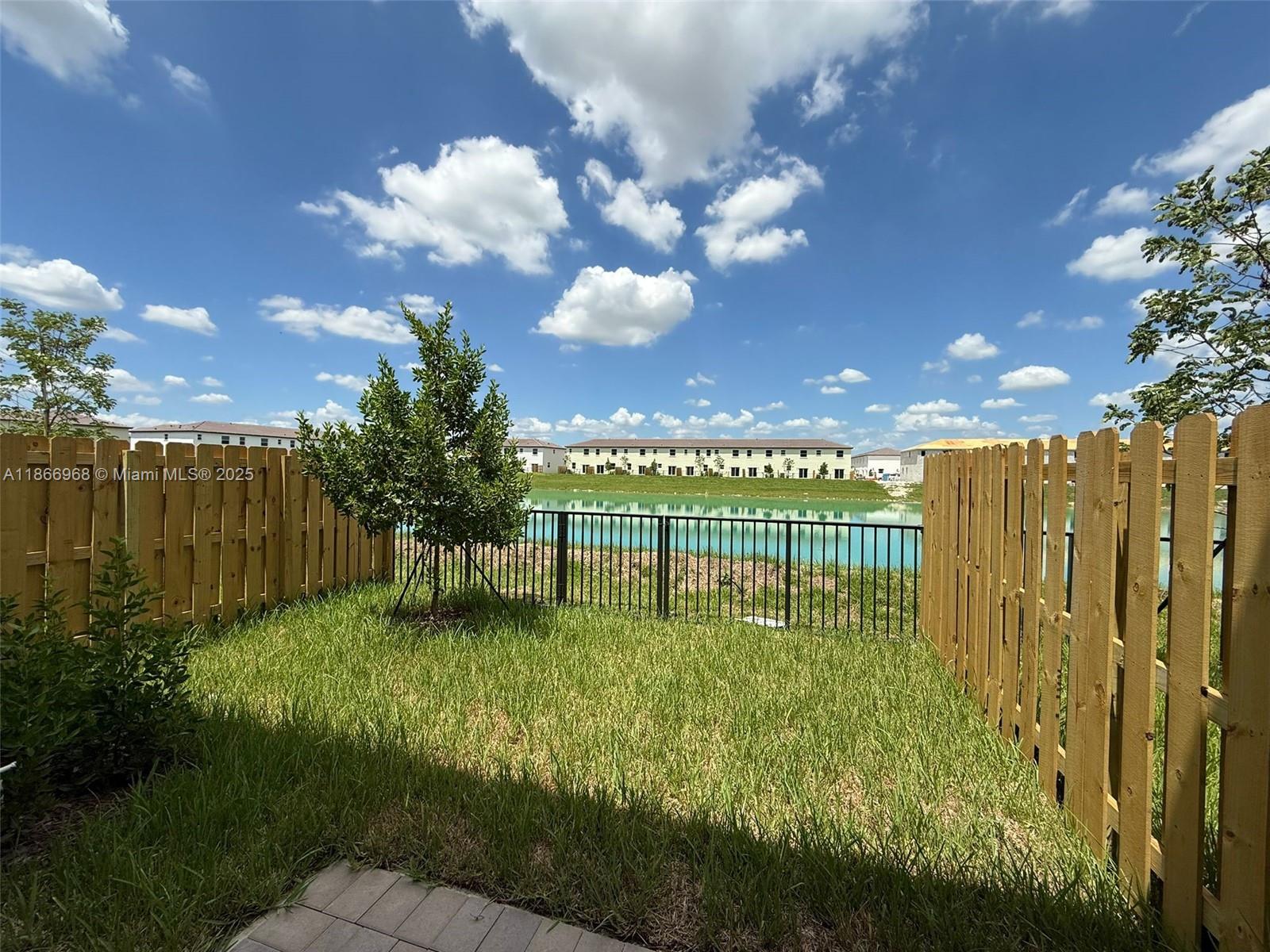 Brand New Townhouse for Rent! Be the first to live in this stunning 3 bed / 2.5 bath home with beautiful lake views, just open the door and enjoy the water! The modern open-concept kitchen features stainless steel appliances, quartz countertops & ample cabinets, connecting to the dining & family room plus a separate living area. Home includes a new washer & dryer, blackout shades in bedrooms, clear shades in common areas, ceramic tile flooring downstairs & cozy carpet upstairs. Relax in the fenced private patio. Internet included! Community amenities: clubhouse, pool & tennis courts under construction. Rent requires first month, security deposit, $500 HOA deposit & pet deposit if applicable.