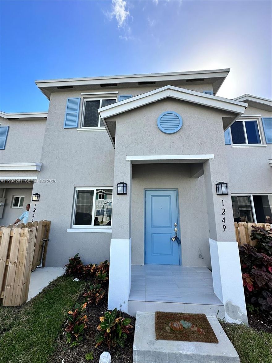 Stunning 4-bedroom, 3-bathroom home featuring a convenient first-floor bedroom with a full bath — perfect for guests or a home office. Three additional bedrooms upstairs. Enjoy a spacious backyard ideal for entertaining and family gatherings. Includes 2 assigned parking spaces right in front of your home. Located in a quiet, well-maintained community with a low HOA of only $70/month. Low property taxes and no Homestead exemption applied — making this an outstanding value opportunity for the right buyer. Don't miss it!