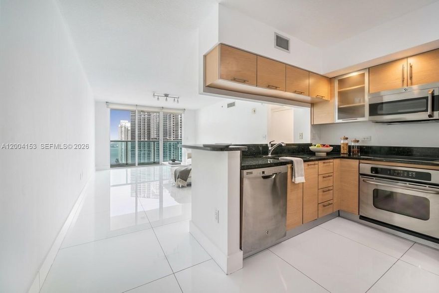 2/2 at Brickell. Spacious high-floor corner unit features two bedrooms and two bathrooms at Brickell on the River Tower North. Interior boasts white porcelain flooring in living areas and brand-new engineered wood laminate flooring in bedrooms. Residence is freshly painted and equipped with stainless steel appliances, a large walk-in closet in the primary suite, and one assigned parking space. This building offers premium amenities, including a pool, gym, and valet parking. Ideally situated in the heart of Brickell, just steps from the Metromover, Brickell City Center, and Brickell Ave. Enjoy southeast exposure with river views. Unit includes high-impact windows, a beautiful balcony, and an open-concept kitchen. PLEASE see **BROKERS REMARKS** please **see brokers remarks for showing instructions, please read ***broker remarks before showing.