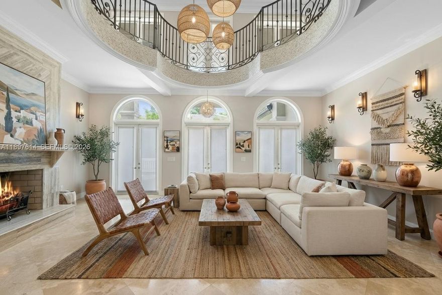 Situated within 24/7 guard-gated Entrada Estates, this Grove estate balances scale, function, and flexibility. Total area around 14,000 SF of A/C living space, including a rare downstairs level with second kitchen, lounge, gym/play areas, office, family room, and 3-car garage. All outlets sit above flood lines with a lift/pump station; primary insurable living starts on the 2nd & 3rd floors. Recent upgrades include new privacy landscaping, pool area enhancements, and new AC units. Features include elevator, 26 cameras, mosquito misting system, 8' solid-core doors, marble & Brazilian cherry floors, and a patio overlooking free-form pool with waterfall, outdoor shower, and cabana bath. Prime location near downtown Coconut Grove, marinas, tennis court, and daily dockage within the community.