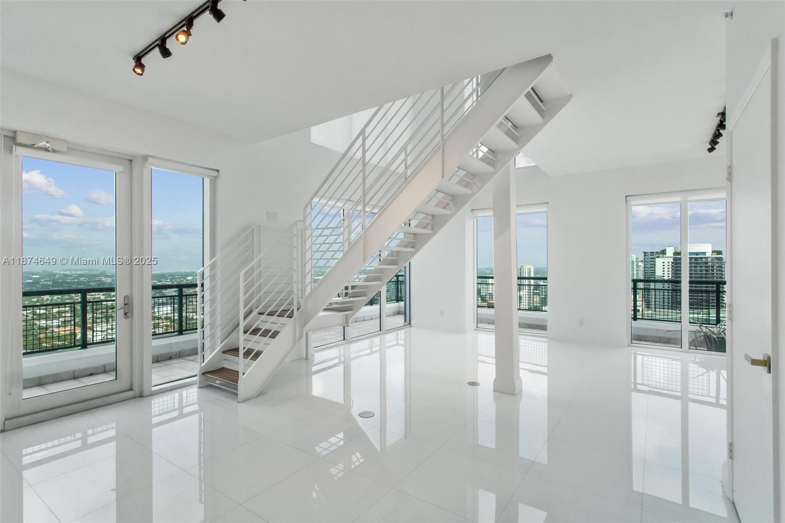 Corner, two story 2BR/2.5BA on the 44 floor - renovated less than two years ago. Light-filled, open layout with extra-high ceilings and floor-to-floor ceiling glass; updated kitchen and baths. Upstairs: both bedrooms with wood floors and stylishly redone bathrooms. Turnkey and move-in ready - or keep the current tenant at $5,300/mo for immediate income. Full-service building with 24/7 security and front desk, gym + spa, pool and BBQ deck, and a ground-level cafe. One assigned parking space. Prime walk-to-everything Brickell location with easy in/out. If your buyer needs 2-bed in Brickell, this is a must-see. Tenant occupied.