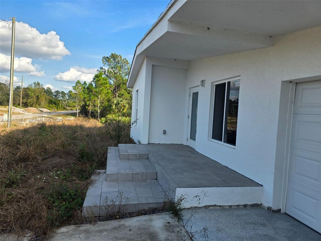 Photo of 2615 SW 32nd St, Lehigh Acres, FL 33976 (MLS # A11953494)