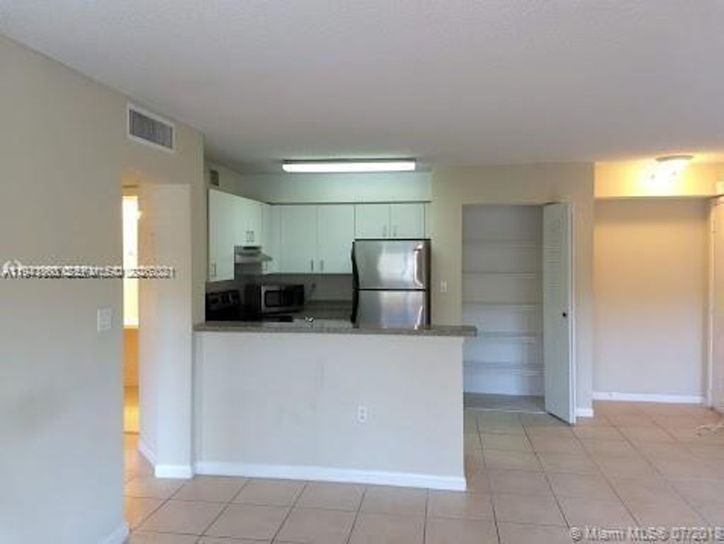 Photo of 761 N Pine Island Rd #203, Plantation, FL 33324 (MLS # A11941368)
