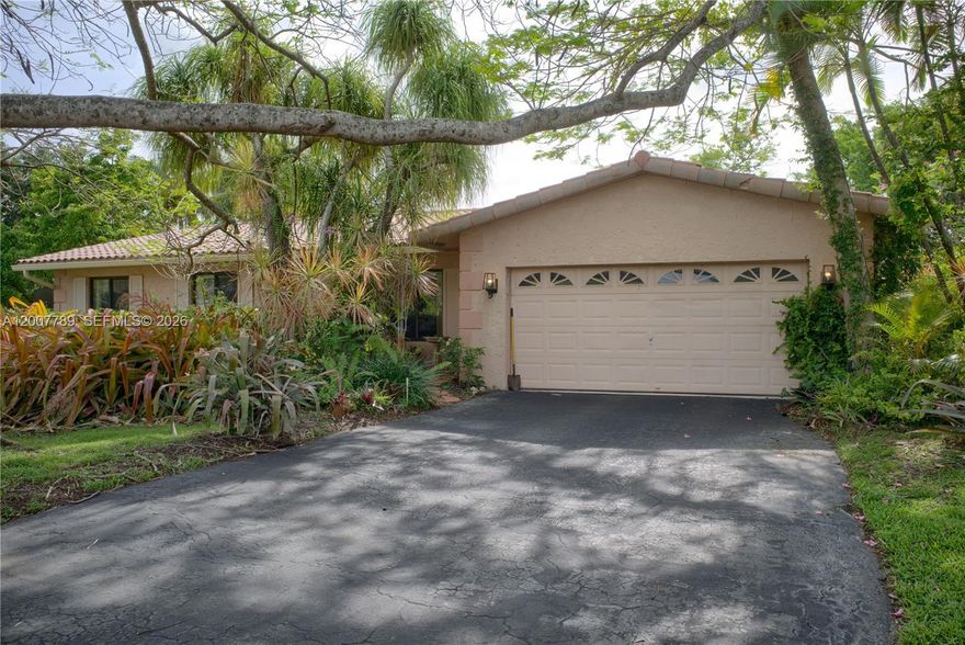 Spacious 3-bedroom, 2-bathroom home offering 1,964sqft of living space on a generous 0.28-acre lot, built in 1972 and featuring tile flooring throughout. Ideally located in one of the most desirable residential neighborhoods in Coral Springs, this property offers a quiet cul-de-sac front entrance and a welcoming curb appeal. The home includes a large living room, walk-in laundry room, ample storage areas, and a 2-car garage with plenty of additional exterior parking. The backyard is beautifully lush and spacious, perfect for relaxing, entertaining, Centrally located, you are within walking distance to schools, parks, restaurants, medical centers, and shopping options. Just a short drive to Downtown Coral Springs and major highways, this home provides excellent convenience for commuting and daily living. Zoned for A+ schools, including Coral Springs Elementary, and with no HOA, this is an outstanding opportunity for both families and investors alike.
