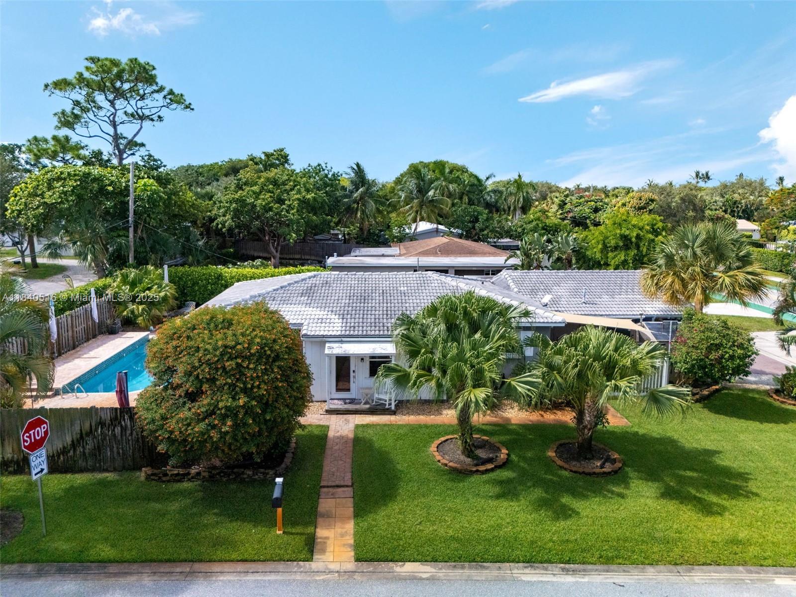 Discover your dream lifestyle in this vibrant corner-lot paradise, perfectly positioned just minutes from the excitement of Downtown Delray and tranquil beaches! This charming 3 bed, 2 bath home features timeless terrazzo floors, a beautifully updated kitchen with premium appliances, natural gas, a whole-house generator, and a carbon-purified water system for exceptional comfort. Entertain effortlessly in your spacious backyard with a sparkling private pool. Enjoy versatility with a fully private efficiency—separate entrance, bedroom, kitchenette, and bath—ideal for guests, in-laws, or rental income. NO HOA! Located just moments from award-winning dining, nightlife, and pristine beaches, it's the ultimate opportunity to embrace the vibrant Delray Beach lifestyle today!