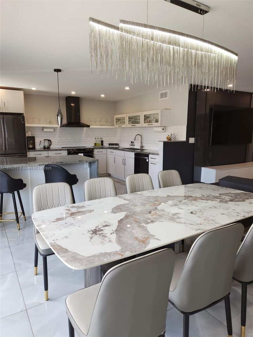 Location, Location!!! Exceptional opportunity to own a Stunning renovated apartment in one of the most desirable locations! This amazing apartment offers modern style, functionality, and coastal lifestyle.  Fully updated kitchen, countertops and stainless steel appliances. Updated flooring, offers 2 spacious bedrooms plus a den, ideal for a home office. Prime location close to  the beach, top shopping malls, and the best dinning in town.  Live where others vacation! This gem combines style, comfort, and unbeatable convenience. This unit is ideal for those who want to enjoy the best that South Florida living has to offer. Don't miss out schedule your showing 24 hours in advance, and see yourself why this apartment is the complete package, style, location, and lifestyle all in one.