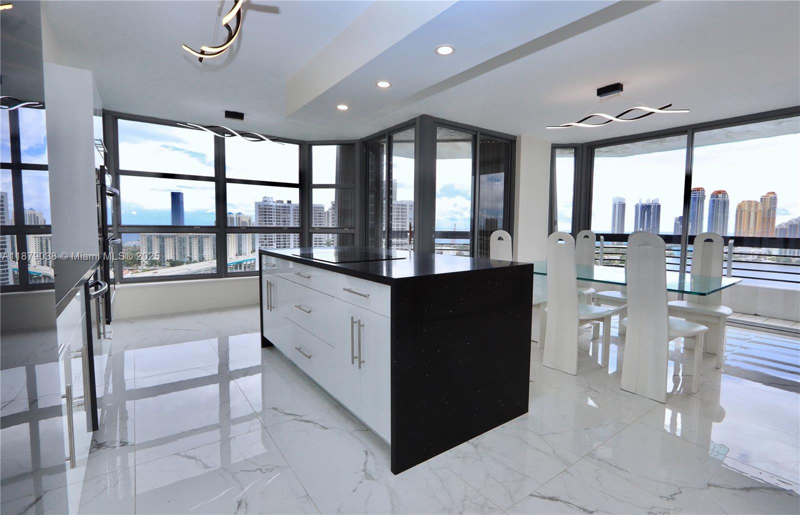 Spectacular renovated 2BR/2BA corner unit with unobstructed panoramic SE views and ocean and intracoastal views from every room! Immaculate kitchen with waterfall countertop. Split floor plan offers privacy, with a spacious primary suite, ensuite bath, and custom walk-in closets. No detail spared—this elegant, functional home is a rare gem. Enjoy resort-style living in the coveted Mystic Pointe community with marina, fitness center, heated pool, library, 7 clay tennis courts, 4 pickleball courts, basketball court, dog park, mini market, a beauty salon, e-car charging stations, an on-site restaurant and convenience shop.