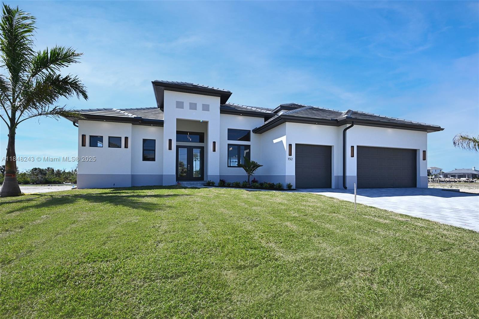 The house is now staged.Discover luxury living in the GRAND CAYMAN 2. 3,400 sq ft 4-bedroom, 4.5-bath masterpiece with a 3-car garage. Western exposure direct Gulf access overlooking the spreader, this home boasts a pool, spa, and grand outdoor living space complete with an outdoor kitchen. Entertain effortlessly with a butler's pantry and revel in the custom cabinetry and quartz countertops throughout. The primary suite features two large walk-in closets, an en-suite bathroom with a soaker tub, and a large shower with 10 ft sliders leading out to your lanai. Upstairs you will find a flex room with balcony, 4th bedroom and full bathroom. Enjoy breathtaking sunsets with the coveted Western exposure. Welcome to your private paradise in this thoughtfully designed haven.