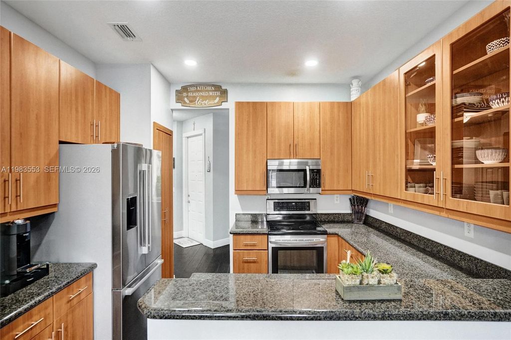 Photo of 12513 NW 56th Dr, Coral Springs, FL 33076 (MLS # A11983553)