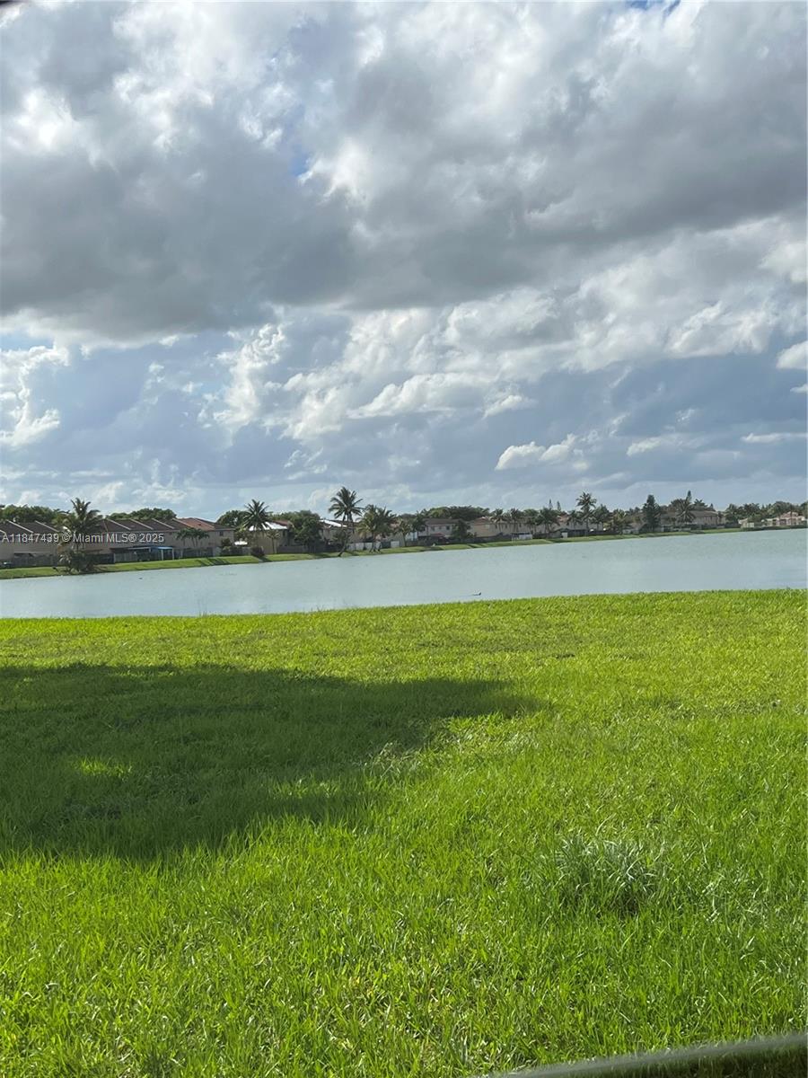 Live by the lake in this stunning 2-story townhouse in the desirable Serena Lakes community! With 3 bedrooms and 2.5 bathrooms, this home offers a bright, open layout, tile flooring downstairs, and brand-new floors upstairs. Enjoy cooking in the spacious kitchen with stainless steel appliances, overlooking the living room and peaceful patio—perfect for relaxing sunsets by the lake. Features include wood stairs, crown molding, French doors, updated bathrooms, walk-in closet, washer/dryer, alarm system, and two storage spaces. Quiet, family-friendly area close to top schools, parks, and major highways. A must-see!