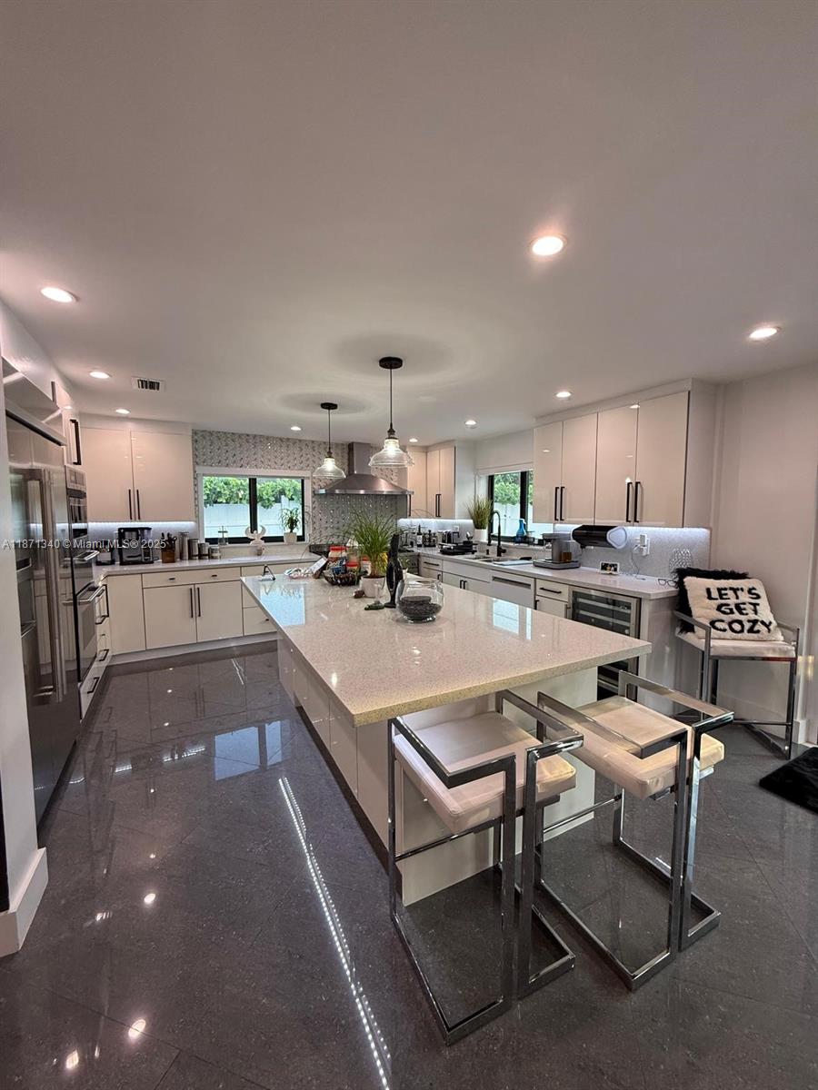 Furnished home available for rent in North Bay Village. Features 3 bedrooms + 1 gym, 4 full bathrooms, a backyard jacuzzi (no pool), and a game area with a billiard table. A boat is docked behind the house and cannot be removed. Spacious and modern layout, perfect for entertaining or relaxing. Move-in ready!