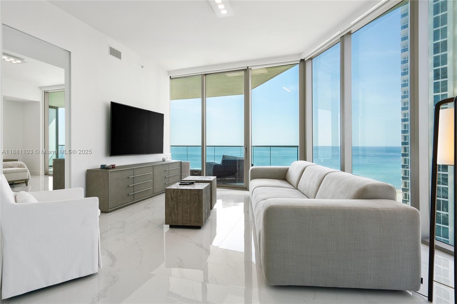 Experience the Armani lifestyle in this oceanfront gem at Sunny Isles Beach. This elegant 2 bedroom + den, 2.5 bathrooms residence showcases 10-foot ceilings and floor-to-ceiling windows framing breathtaking ocean and city views. An oversized balcony with a summer kitchen extends your living space outdoors. Inside, Armani’s signature touch is reflected in the custom finishes and top-tier appliances. Residents enjoy an unmatched collection of amenities, including private oceanfront dining, the tranquil Armani Spa, a state-of-the-art fitness center with direct beach access, movie theater, cigar lounge, children’s playroom, and more.
