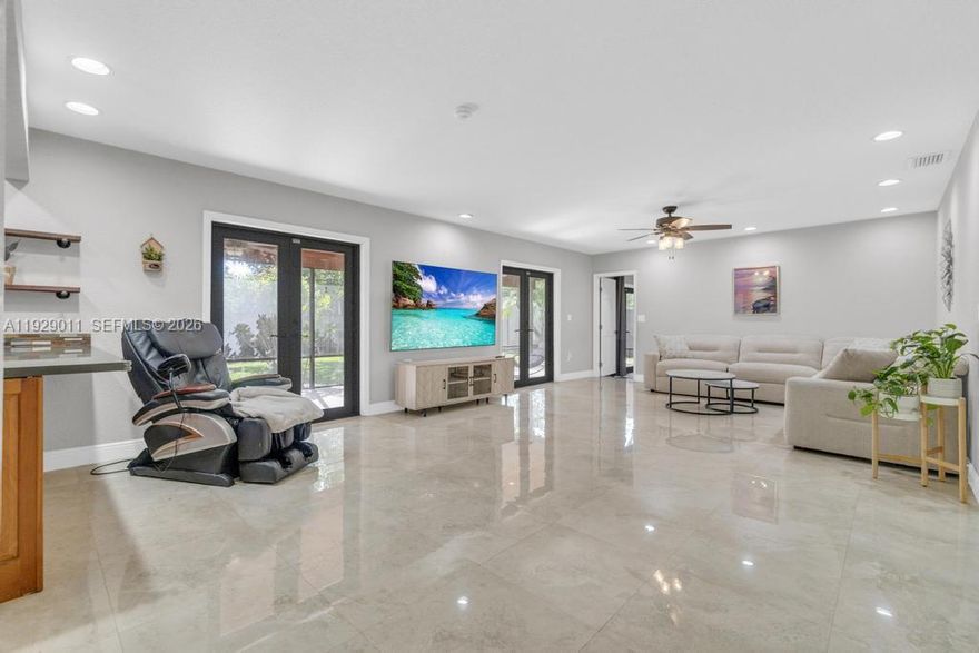 This is NOT your ordinary 3-bedroom home.This elegant single-family home offers an exquisite blend of comfort and style, perfect for those seeking a tranquil retreat with modern conveniences. This expansive floor plan offers 2,291 square feet of living space with a spacious split floor plan and tile flooring throughout.The heart of this home is its inviting living area, seamlessly connected to a well-appointed kitchen equipped with new appliances making it a delightful space for culinary adventures and entertaining guests.The home features a newer roof, impact windows, eave lights, refrigerator/stove 2025, AC, 2023, washer/dryer 2022 and has been freshly painted. Enjoy a spacious screened terrace that opens to a lush backyard adorned with fruit trees. Set on a 17,015-square-foot lot, the property includes a long driveway, covered carport, and a two-car garage. Free from CDD and HOA fees. Come and experience this comfortable residence in unincorporated Miami offering numerous opportunities for multi-generational families or just  want space.