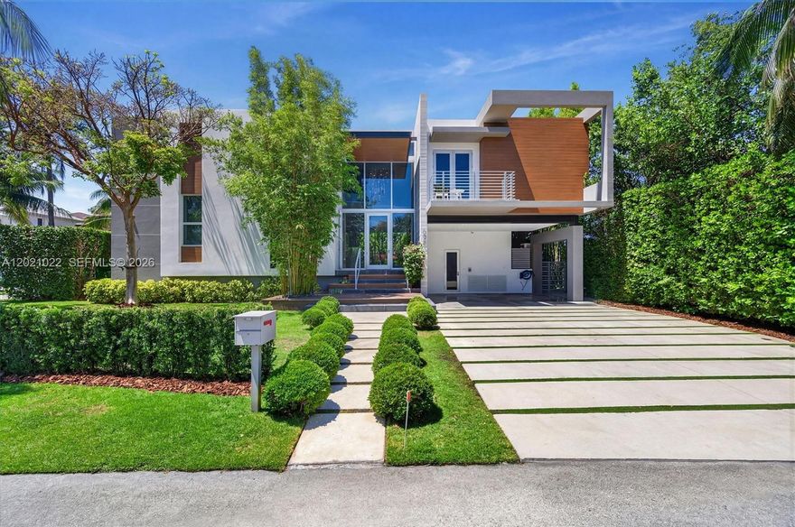 A modern Key Biscayne home elevated by $1M+ in owner upgrades. This 5BD/5.5BA, two-story residence spans 4,416 SF and lives like new—built in 2017 and thoughtfully enhanced throughout. The first floor flows around stunning pool views, anchored by an open living, dining, and Miele kitchen. Clean lines and warm woods balance bold with inviting. A dedicated gym, office, laundry, and media room with projector & hidden screen complete the interior. Smart-home tech controls sound (hidden speakers and projector), lights, and alarm. Full-perimeter camera system and rooftop solar with battery backup add security and efficiency. Move-in ready contemporary living at its finest on the island on a quiet pedestrian-free street.