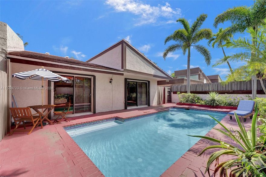 Move in ready! This spacious 2bedroom,2bathroom townhouse with a private pool is nestled in a secure, gated community. Enjoy the peace and tranquility of your private pool, surrounded by lush landscaping perfect for entertaining and family gatherings. The updated kitchen boasts stainless steel LG appliances, granite countertops, and custom-made solid cabinets.This home offers roomy living areas, an eat-in kitchen, plenty of natural light,hurricane shutters,volume ceilings, a resurfaced roof, and ample storage space.Recently appraised for a much higher price. Conveniently located near major highways, beaches, shops, and entertainment, this villa offers the best of both comfort and convenience. Don't miss the opportunity to make this your dream home.Seller relocating.Schedule a showing today