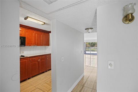 Photo of 661 N University Dr #1-103, Pembroke Pines, FL 33024 (MLS # A12069979)