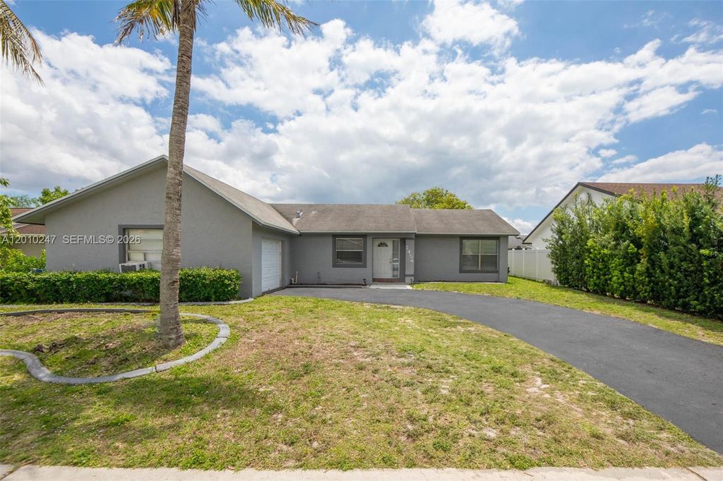 Photo of 7454 NW 48th Pl, Lauderhill, FL 33319 (MLS # A12010247)