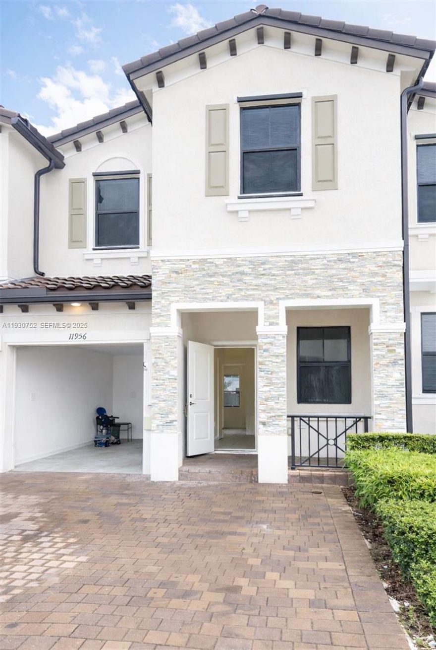 Impeccable Townhouse at the beautiful resort style. 4 bed | 2.5 baths garage and patio. Located in the new a  community built-in 2022, spacious rooms, kitchen with counter tops, stainless steel appliances. Open layout concept to the family room. Tiled first floor and carpet on second floor, hurricane protection. This resort style community offer all the amenities including club houses, with pool, game room, gym. Conveniently located minutes from Florida Turnpike  with easy access to main streets . Don't miss this opportunity!!