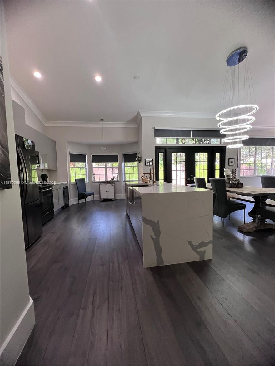 Gated community of Hibiscus Island! Stunning corner home in the heart of Weston! Featuring 3 spacious bedrooms and 2 full baths, this gem is located in a quiet, family-friendly community with top-rated schools. Gated community,  Fully remodeled home electronic blackout curtains, brand new roof and modern kitchen. Comfortable patio, walk to A-rated Tequesta Trace Middle School and Close to highways. Move-in ready!. Don’t miss the chance to live in one of the most sought-after neighborhoods—comfort, style, and location all in one!